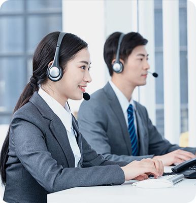 The salesperson is responding to customer inquiries.